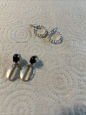 2 silver tone earrings set one hoops and one dangle worn black accents